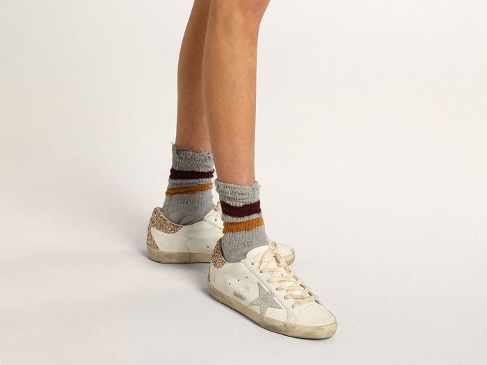 GOLDEN GOOSE Super-Star sneakers with snake-print silver leather star and gold glitter heel tab